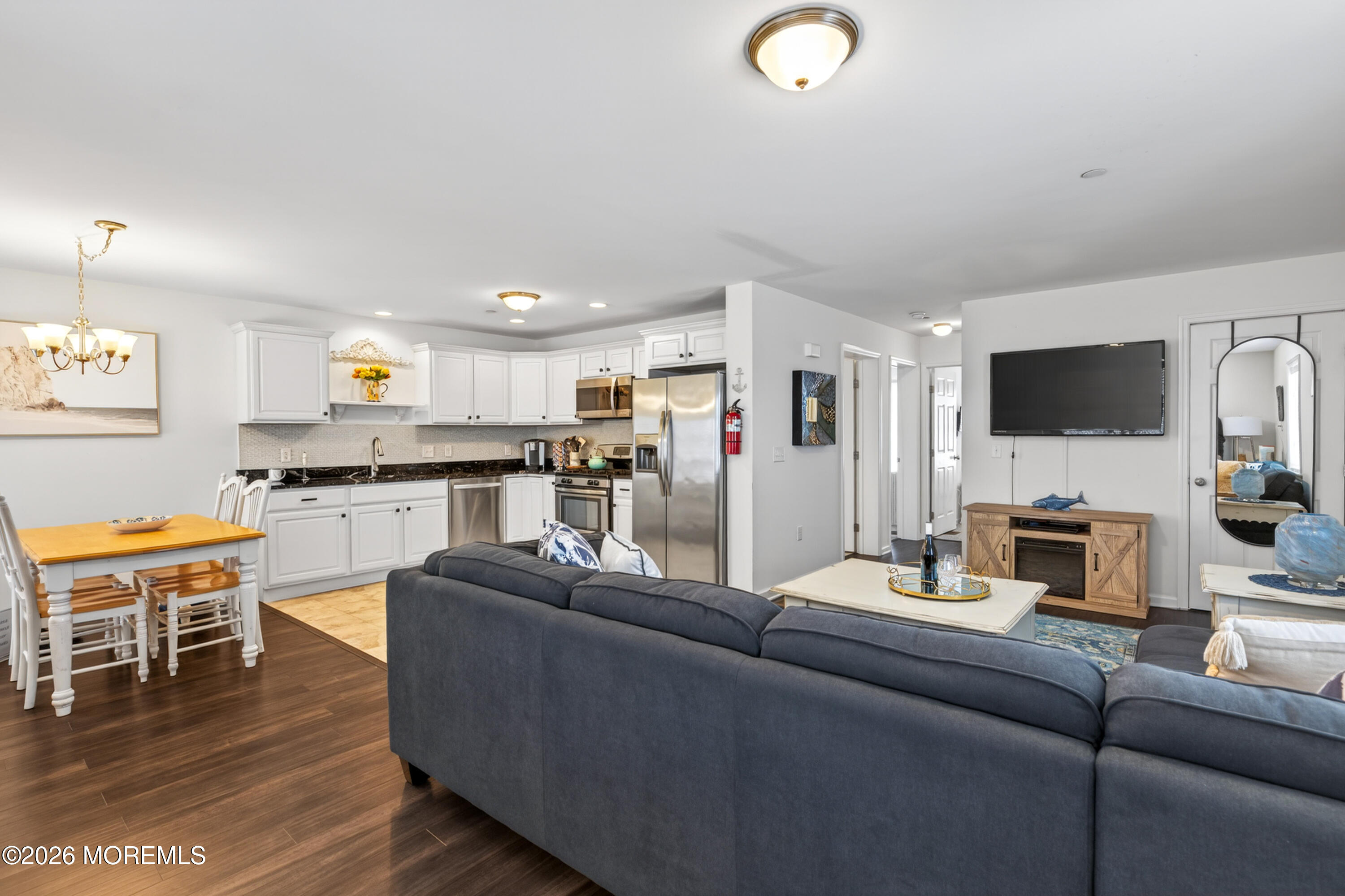 2033 Highway 35, Unit 3 Seaside Heights, NJ 08751 - Photo 16 of 45 a living room with furniture and a flat screen tv