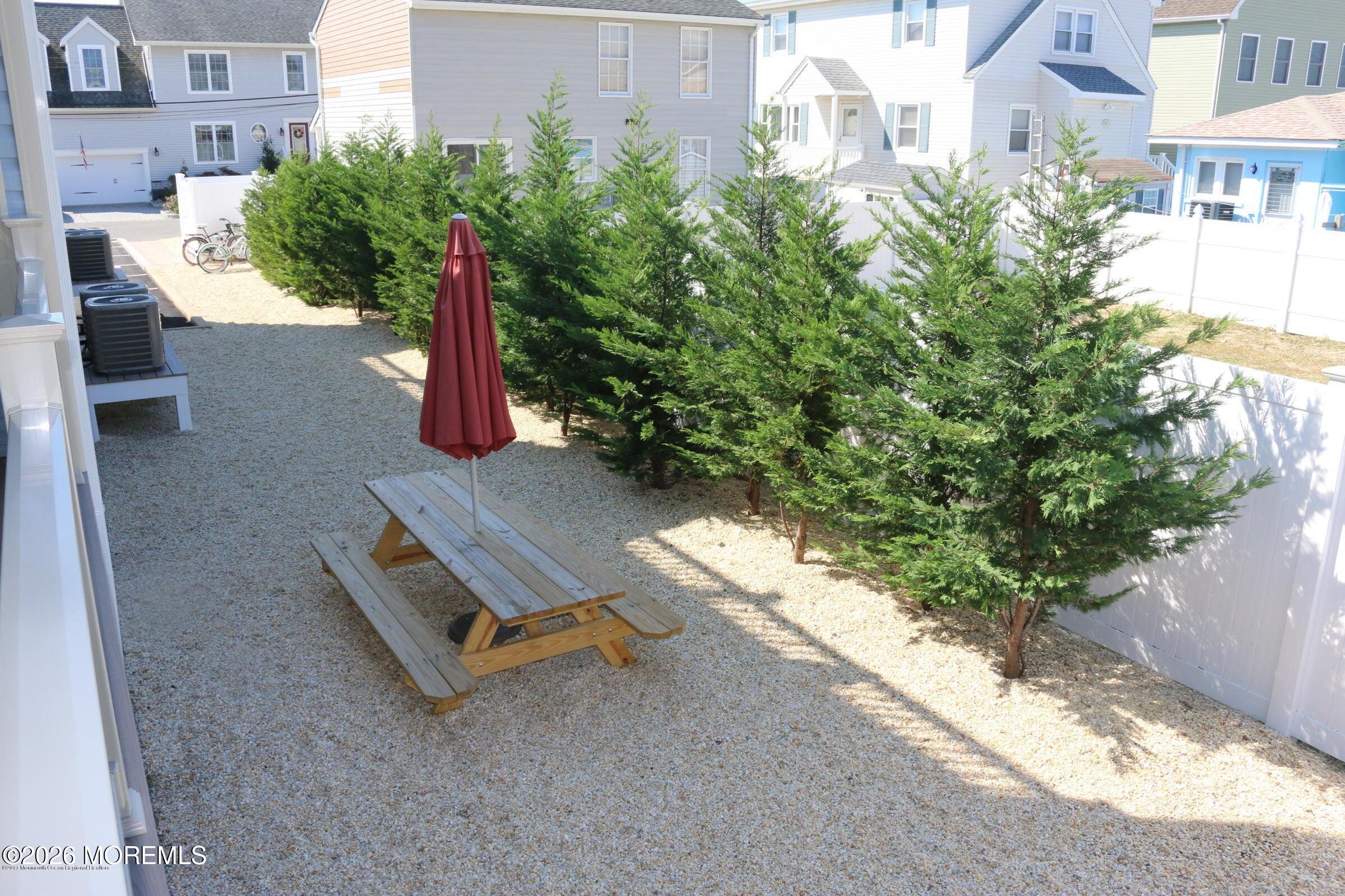 2033 Highway 35, Unit 3 Seaside Heights, NJ 08751 - Photo 27 of 45 a backyard of a house with a yard and outdoor seating