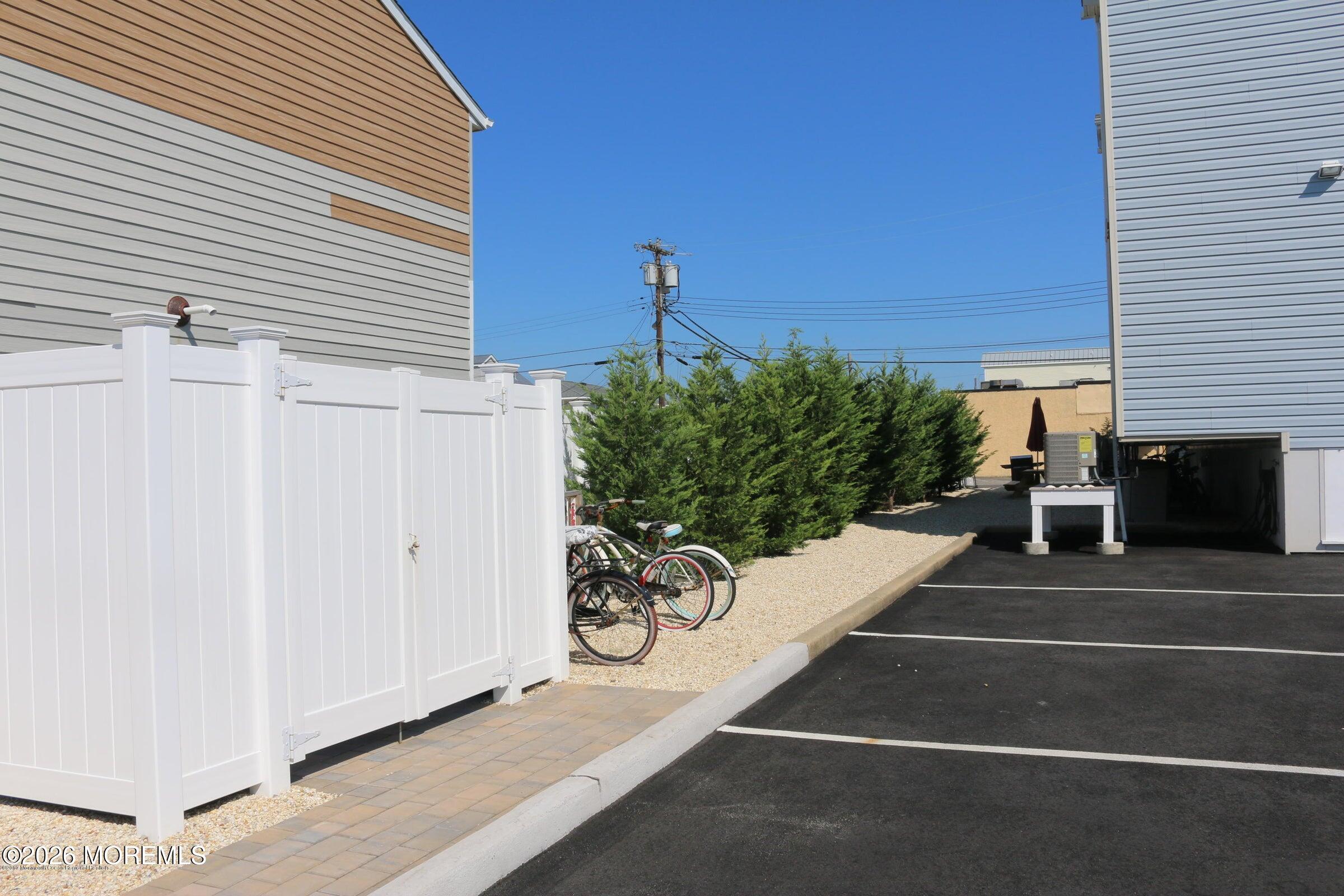 2033 Highway 35, Unit 3 Seaside Heights, NJ 08751 - Photo 35 of 45 a view of a patio with table and chairs potted plants