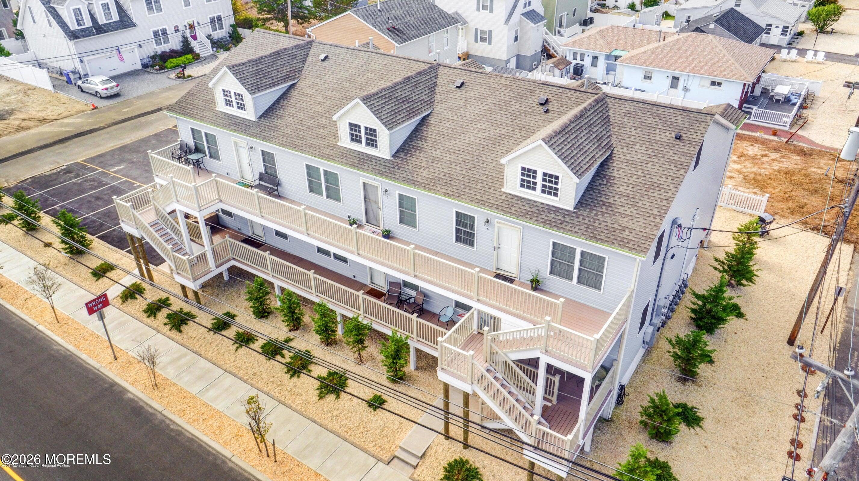 2033 Highway 35, Unit 3 Seaside Heights, NJ 08751 - Photo 4 of 45 an aerial view of a house with a large pool
