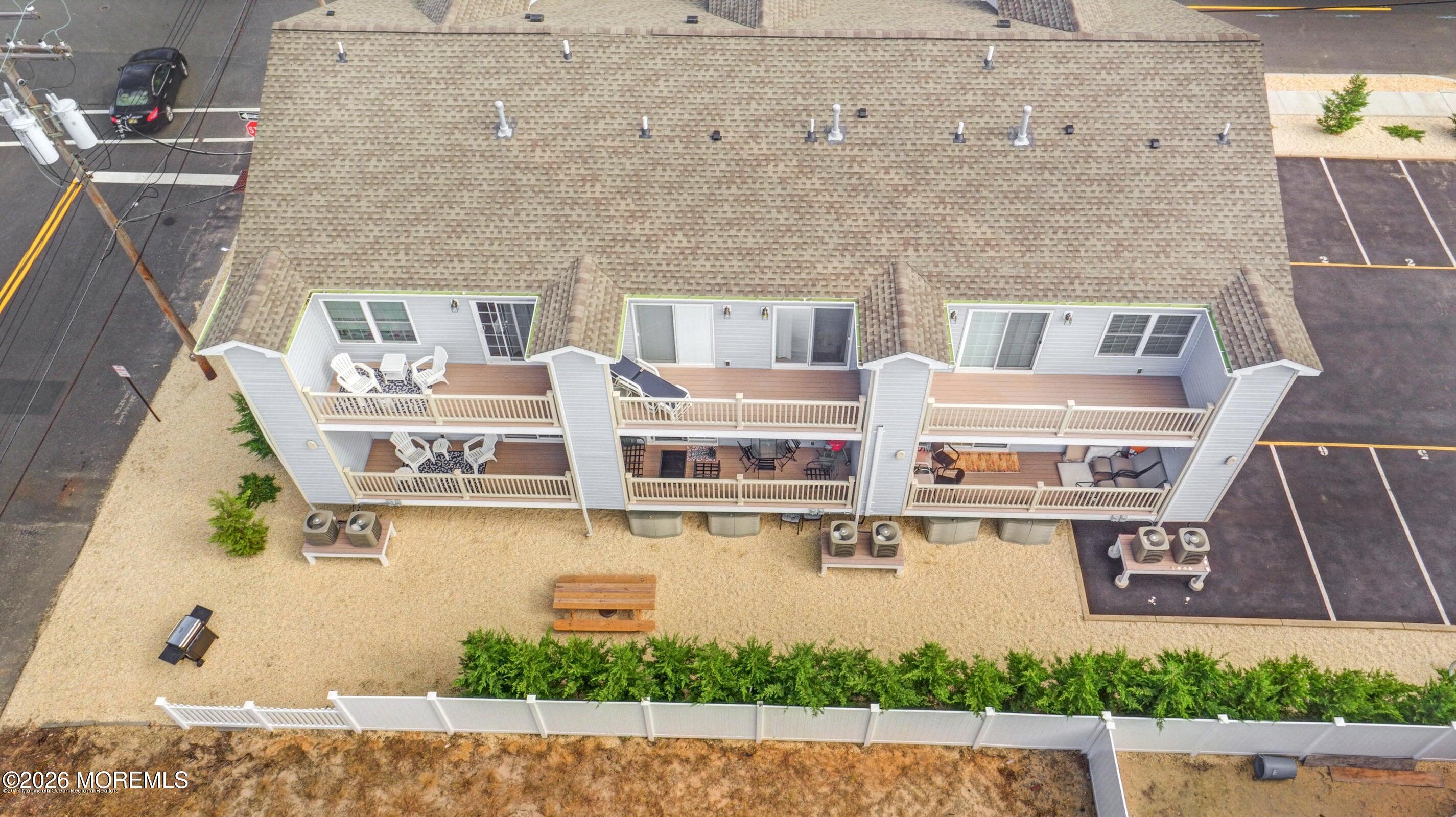 2033 Highway 35, Unit 3 Seaside Heights, NJ 08751 - Photo 5 of 45 a front view of a building with glass windows