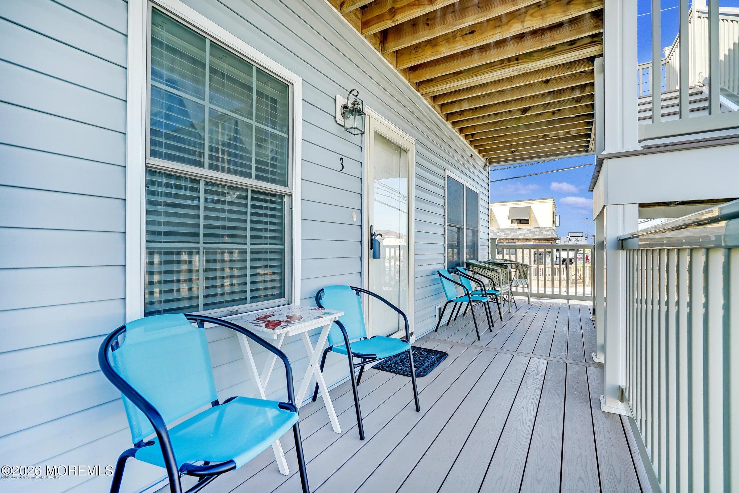 2033 Highway 35, Unit 3 Seaside Heights, NJ 08751 - Photo 6 of 45 a view of a patio with a table and chairs