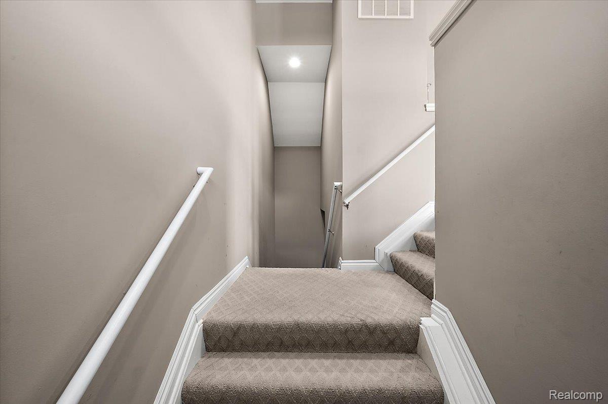 2877 Hartwick Drive Rochester, MI 48307 - Photo 12 of 44 Stairs featuring carpet floors and baseboards