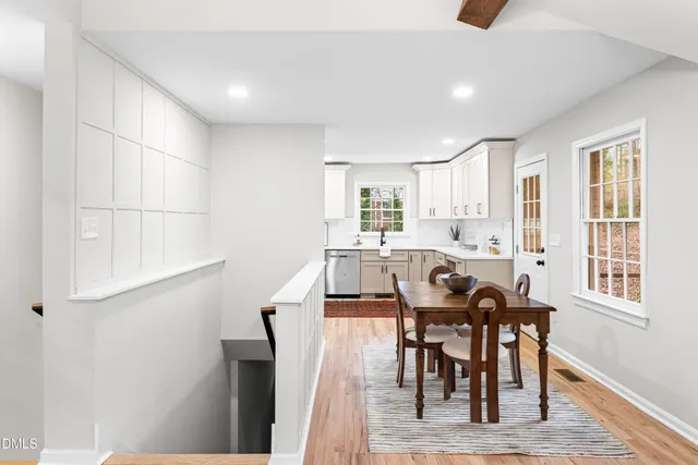 a view of a dining room with furniture and wooden floor