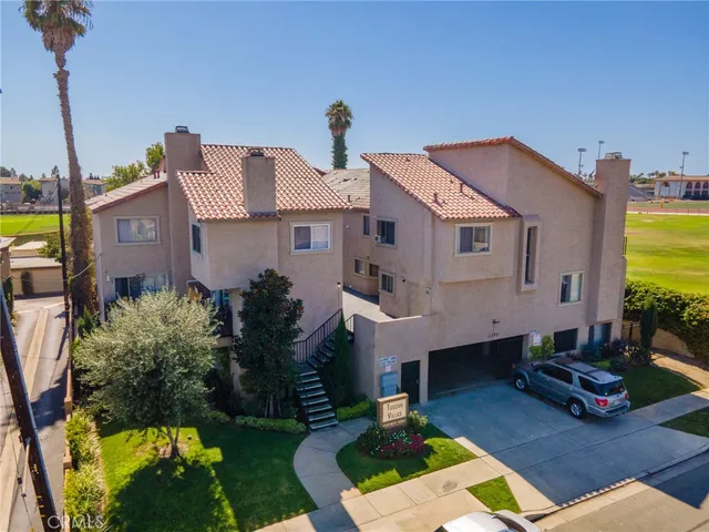 a aerial view of a house with swimming pool in front of it