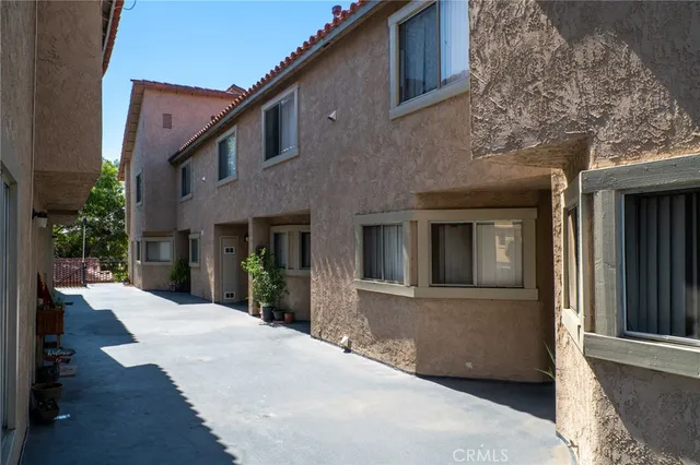 a front view of a house with a yard outdoor seating and garage