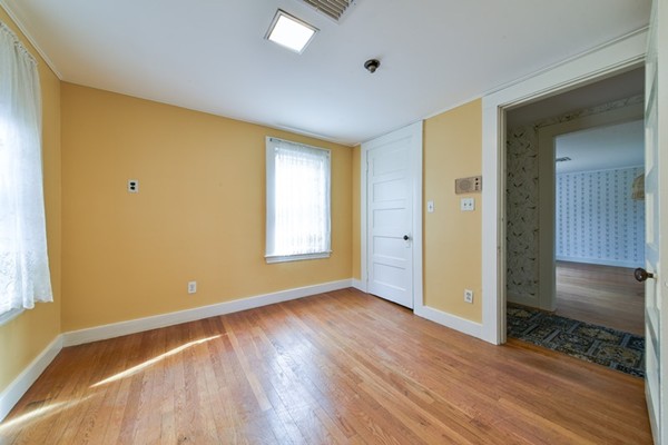 33 R Cedar Street Wellesley, MA 02481 - Photo 13 of 21 a view of room with window and wooden floor