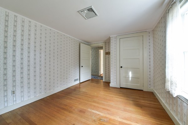 33 R Cedar Street Wellesley, MA 02481 - Photo 14 of 21 a view of an empty room with wooden floor and a window