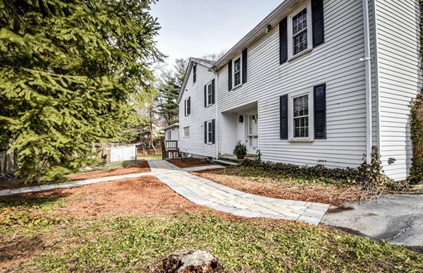 33 R Cedar Street Wellesley, MA 02481 - Photo 19 of 21 a view of a house with a patio