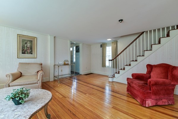 33 R Cedar Street Wellesley, MA 02481 - Photo 4 of 21 a living room with furniture or wooden floor and a potted plant