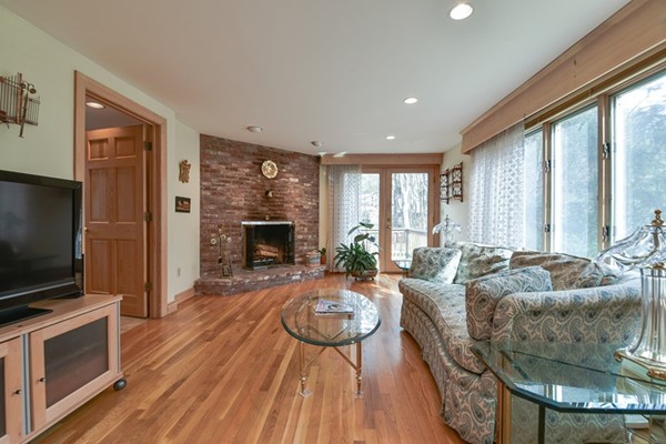 33 R Cedar Street Wellesley, MA 02481 - Photo 7 of 21 a living room with fireplace furniture and a flat screen tv