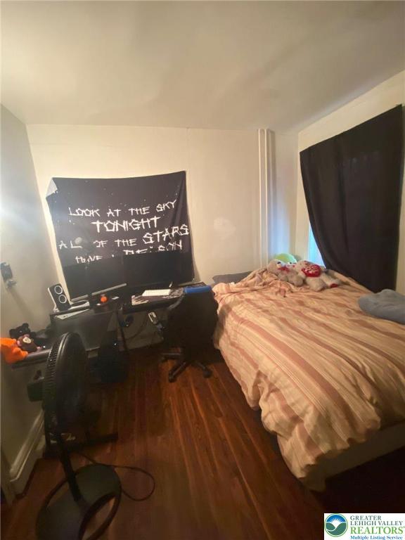 956 West Maple Street Allentown, PA 18102 - Photo 10 of 22 a bedroom with a bed and a painting on the wall