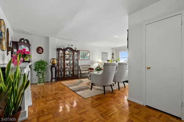 a workspace room with furniture and wooden floor