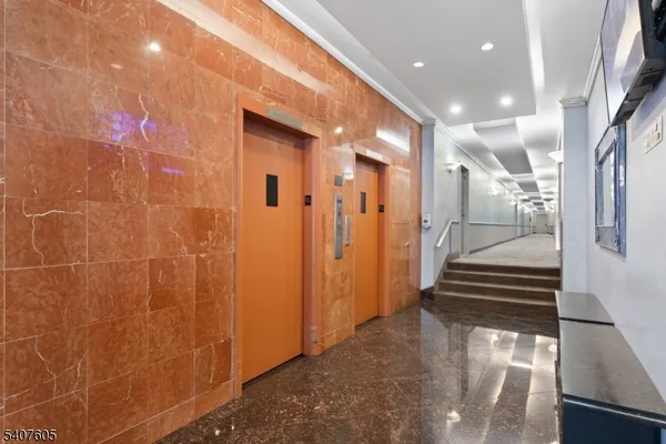 a view of a hallway with stairs