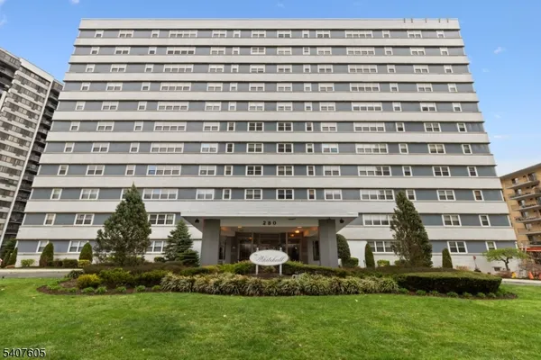 front view of a building with a garden