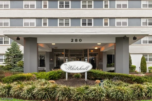 a view of a porch with a table and chairs in a patio