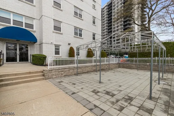a view of a brick building with many windows