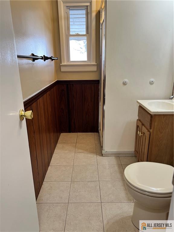 3257 Washington Road Sayreville, NJ 08859 - Photo 7 of 16 a bathroom with a sink a toilet a window and vanity