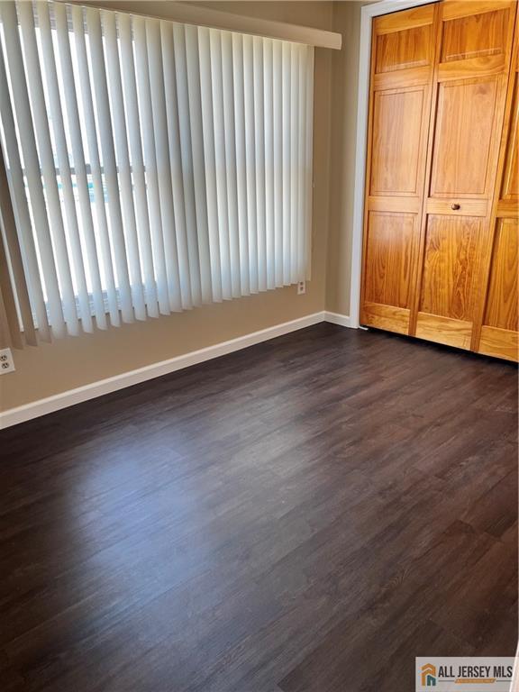 3257 Washington Road Sayreville, NJ 08859 - Photo 10 of 16 an empty room with wooden floor and windows