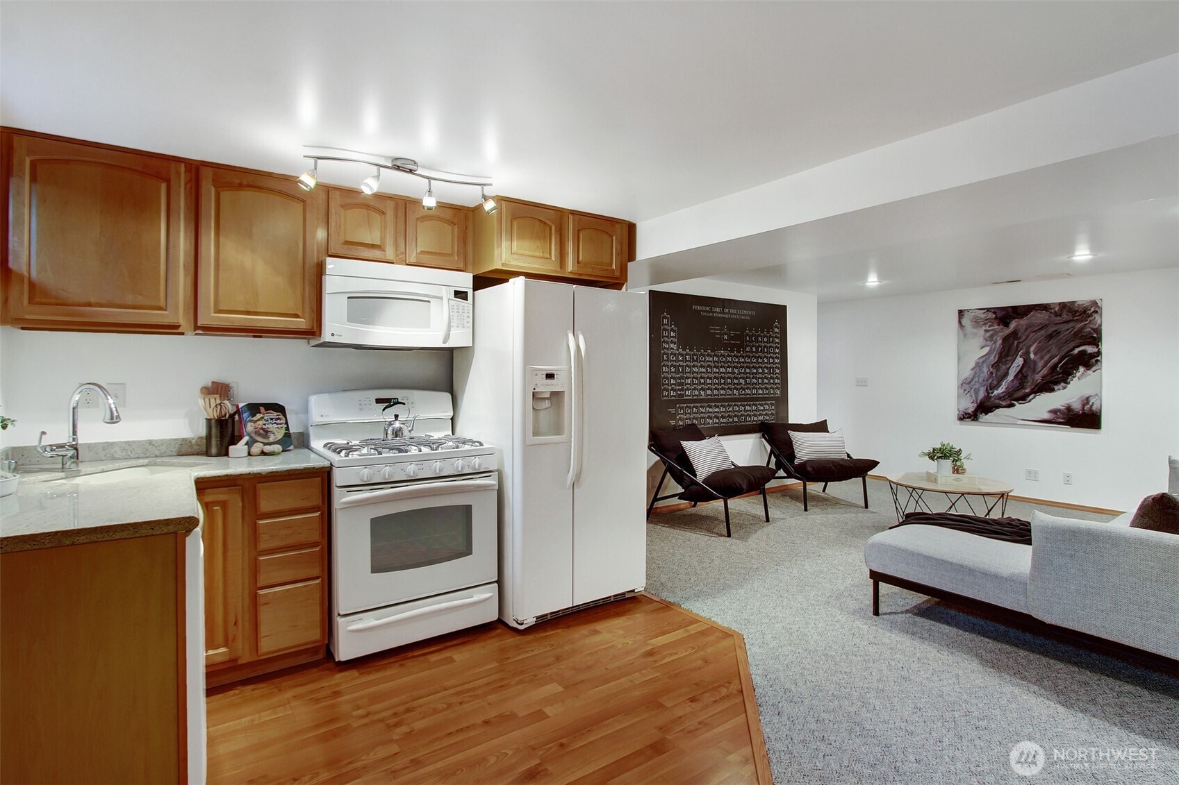3236 32nd Avenue West Seattle, WA 98199 - Photo 16 of 33 a kitchen with stainless steel appliances a stove a sink cabinets and a refrigerator