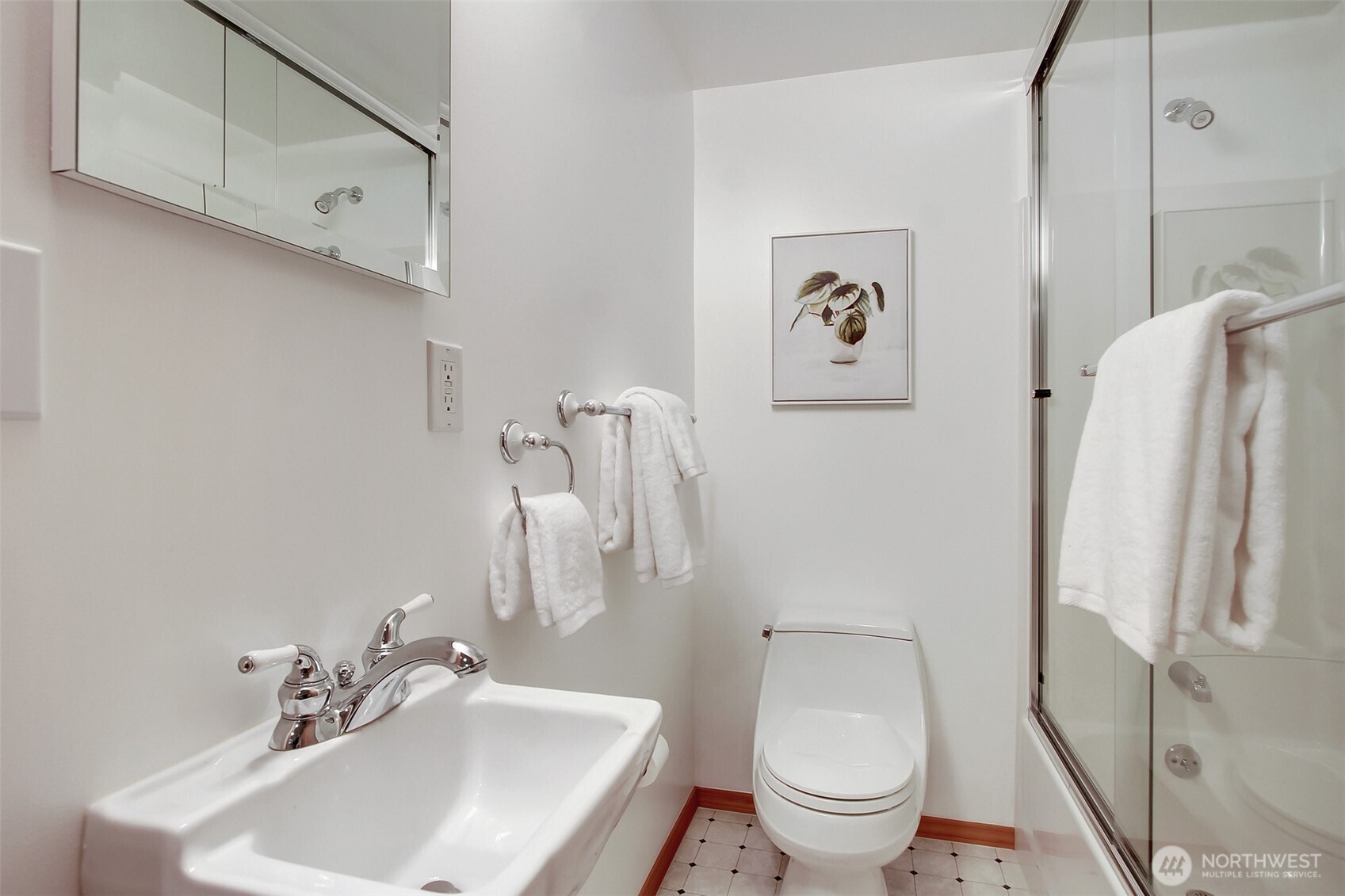 3236 32nd Avenue West Seattle, WA 98199 - Photo 19 of 33 a bathroom with a toilet sink and mirror