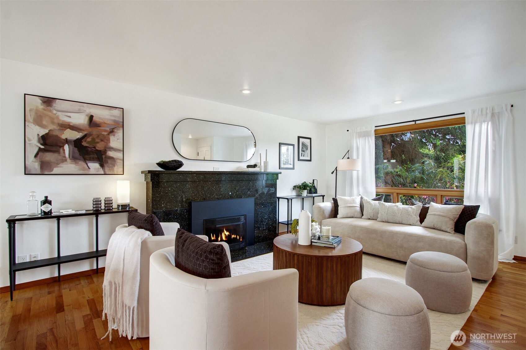 3236 32nd Avenue West Seattle, WA 98199 - Photo 2 of 33 a living room with furniture and a fireplace