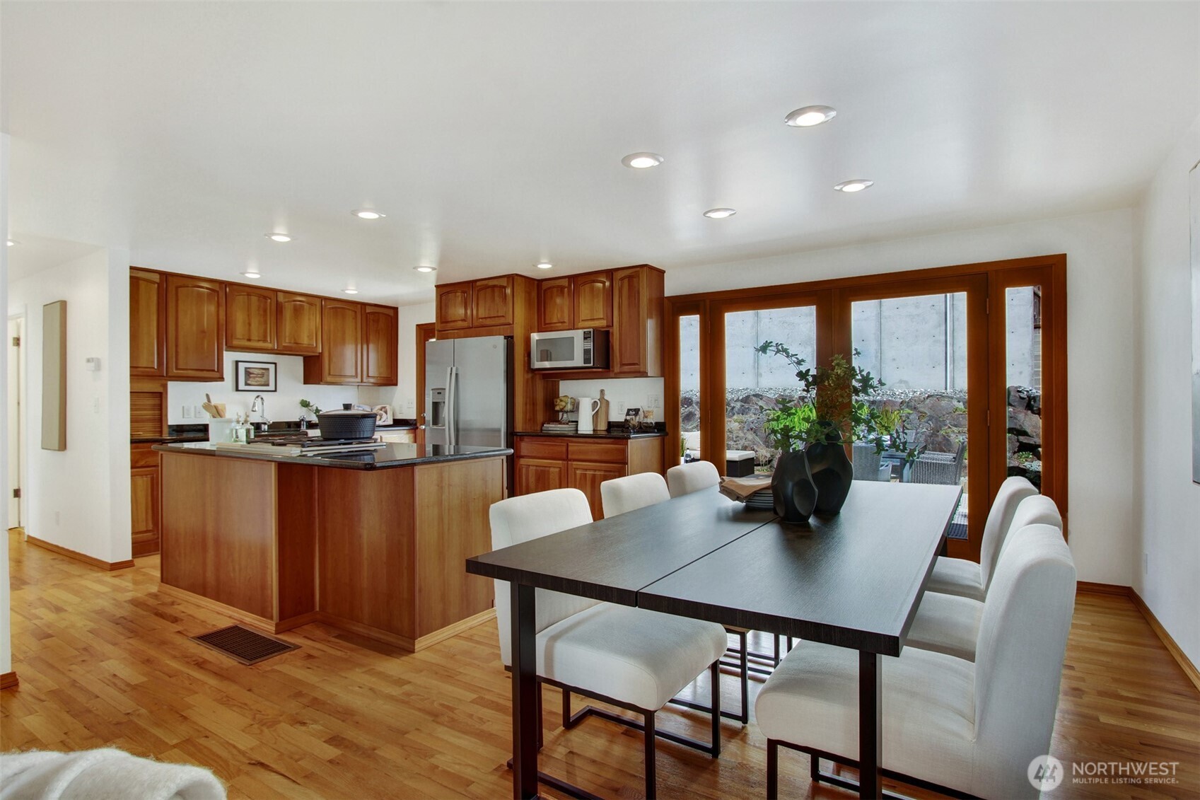 3236 32nd Avenue West Seattle, WA 98199 - Photo 5 of 33 a view of a dining room with furniture window and wooden floor