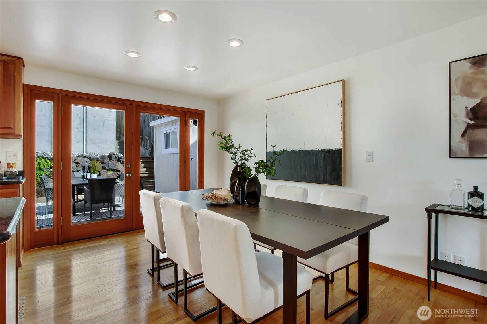3236 32nd Avenue West Seattle, WA 98199 - Photo 9 of 33 a view of a dining room with furniture window and wooden floor