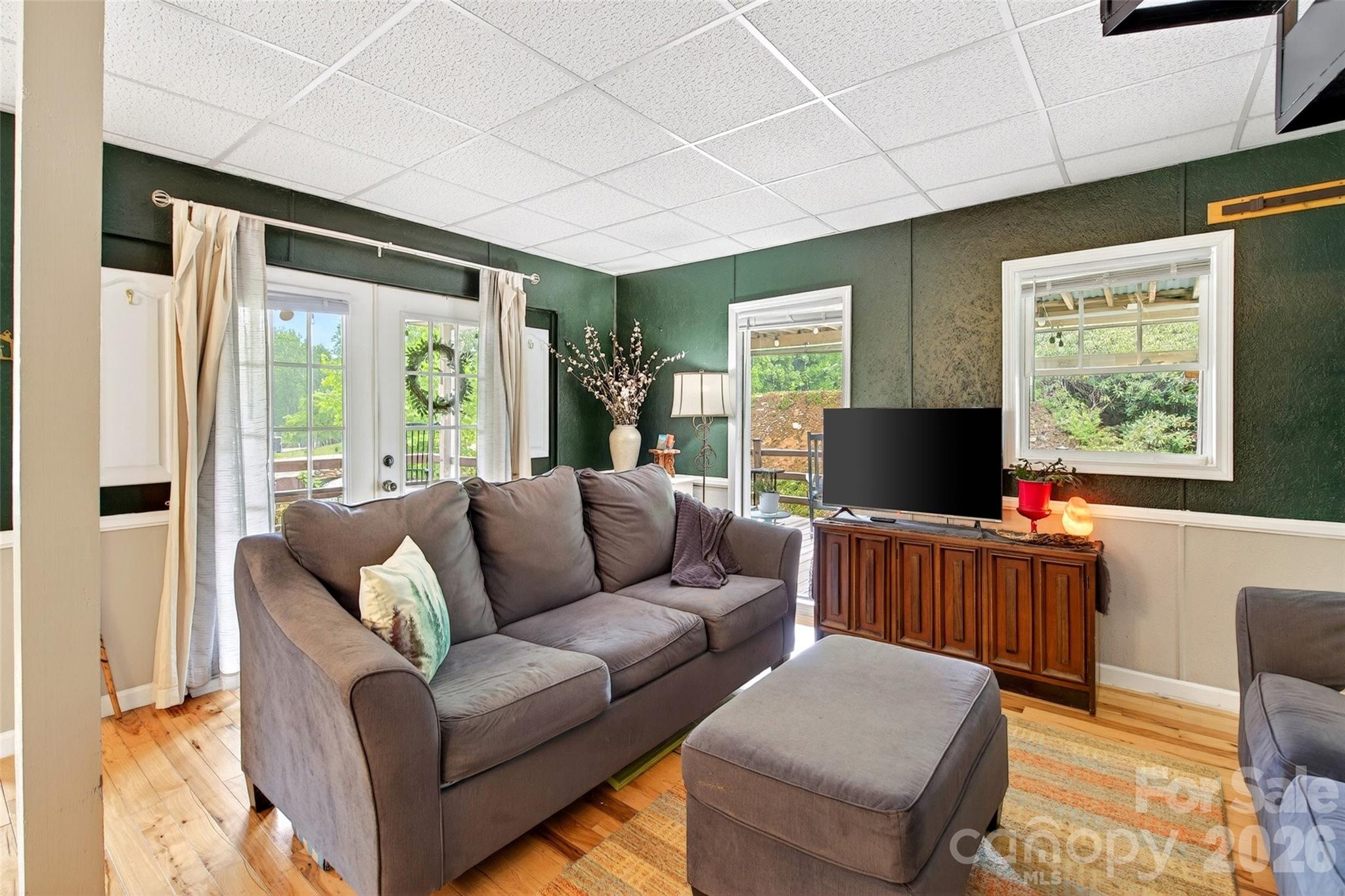 227 Locust Cove Road Marion, NC 28752 - Photo 6 of 34 a living room with furniture and a flat screen tv