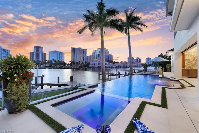 a view of a swimming pool with a lounge chair