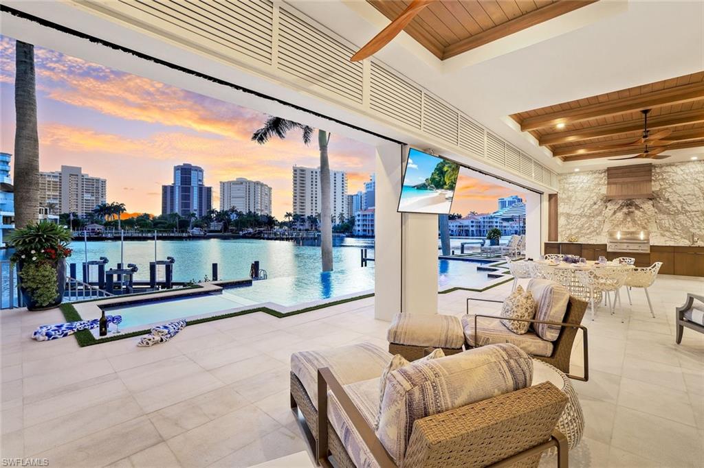 309 Neapolitan Way Naples, FL 34103 - Photo 29 of 33 a outdoor space with furniture