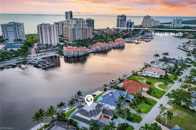 a view of a lake with a table and chairs