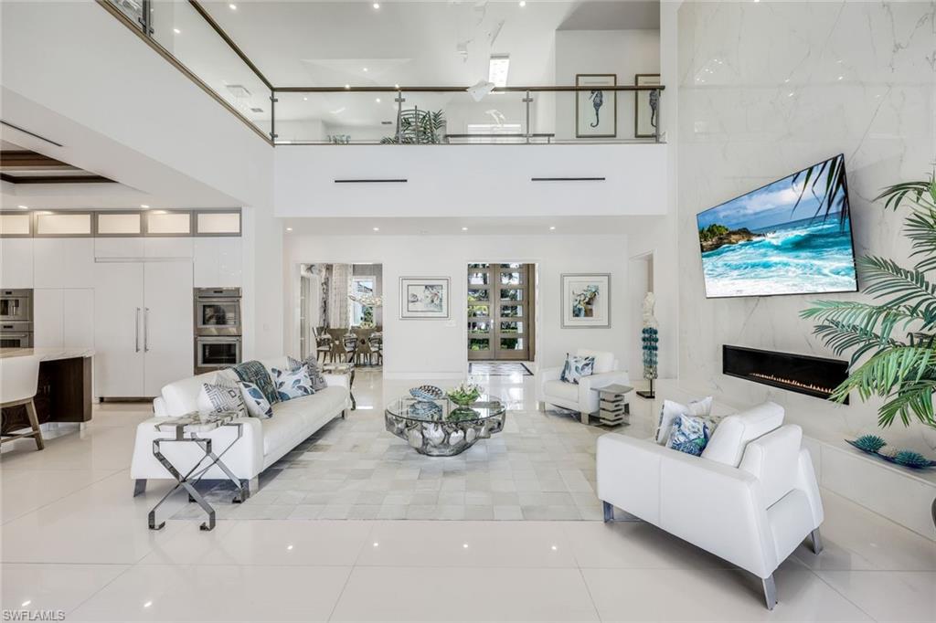 309 Neapolitan Way Naples, FL 34103 - Photo 7 of 33 a living room with furniture