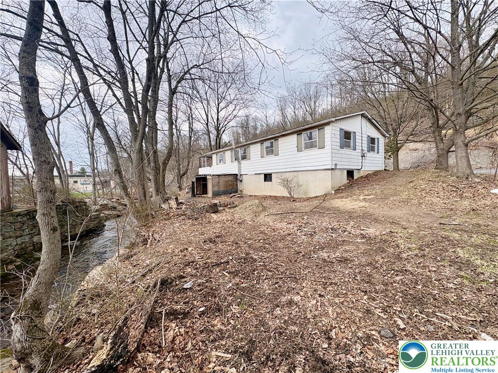 211 Fireline Road Bowmanstown, PA 18071 - Photo 4 of 13 a house that has a tree in front of it