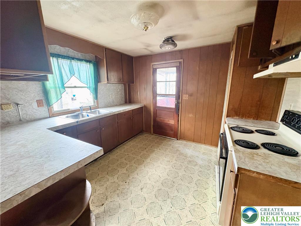 211 Fireline Road Bowmanstown, PA 18071 - Photo 5 of 13 a kitchen with a stove a sink and a refrigerator