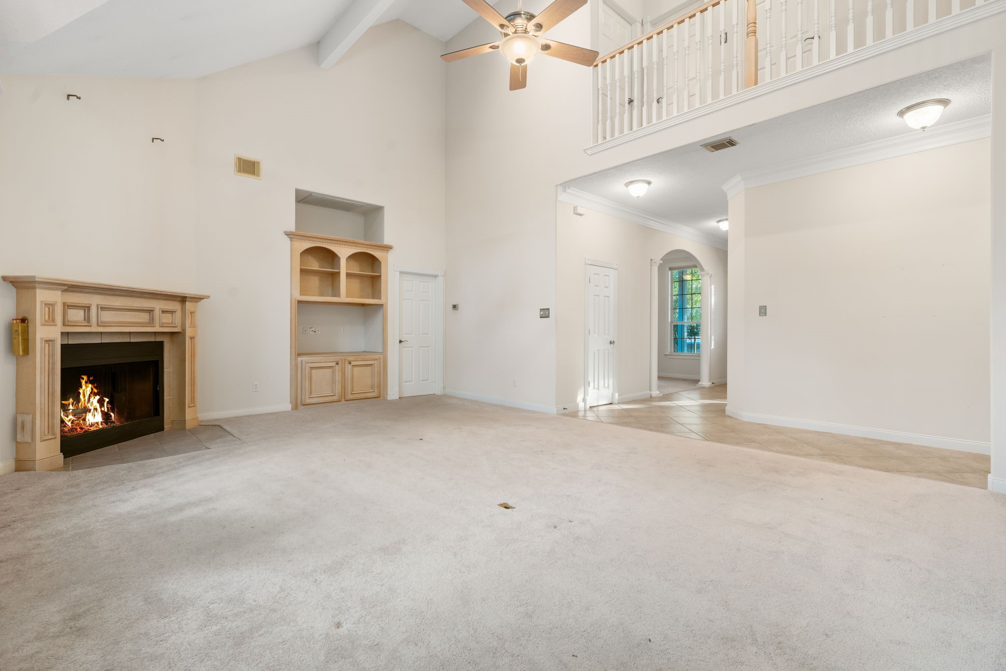 11506 Walden Road Montgomery, TX 77356 - Photo 15 of 50 a view of an empty room with a fireplace