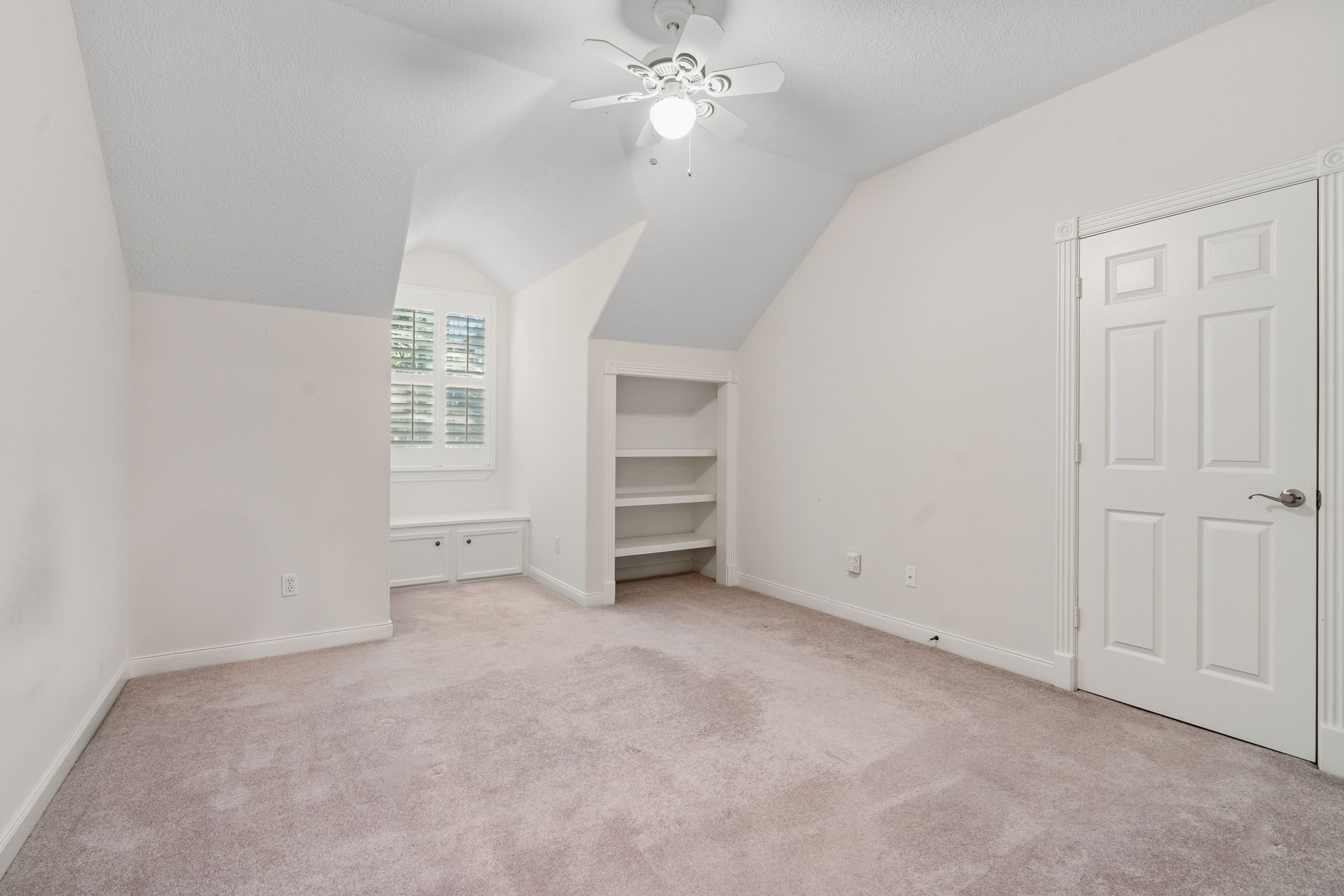 11506 Walden Road Montgomery, TX 77356 - Photo 28 of 50 Bedroom upstairs has storage under the dormer window with shutters and a built-in storage area.