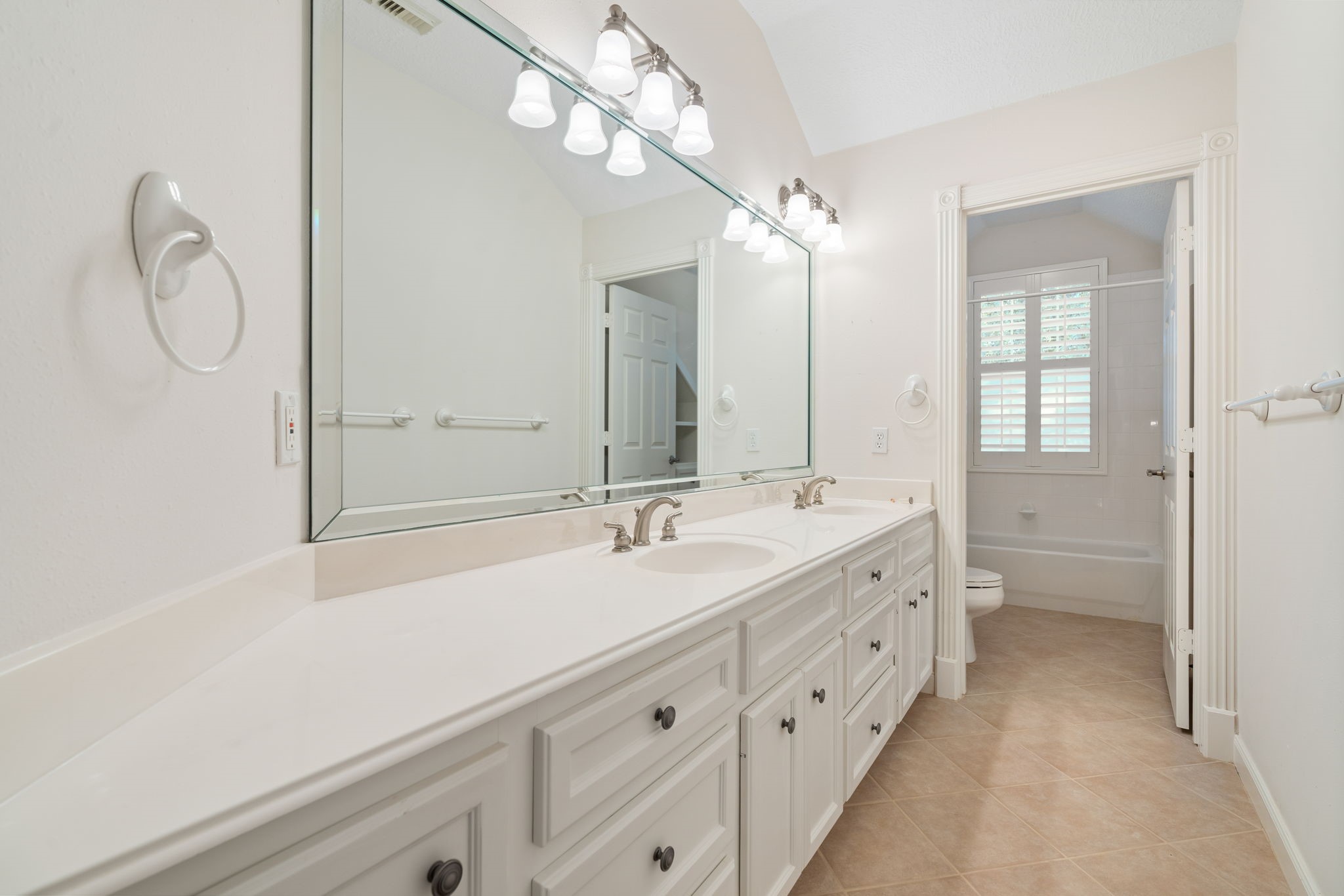11506 Walden Road Montgomery, TX 77356 - Photo 30 of 50 a spacious bathroom with a double vanity sink and a mirror