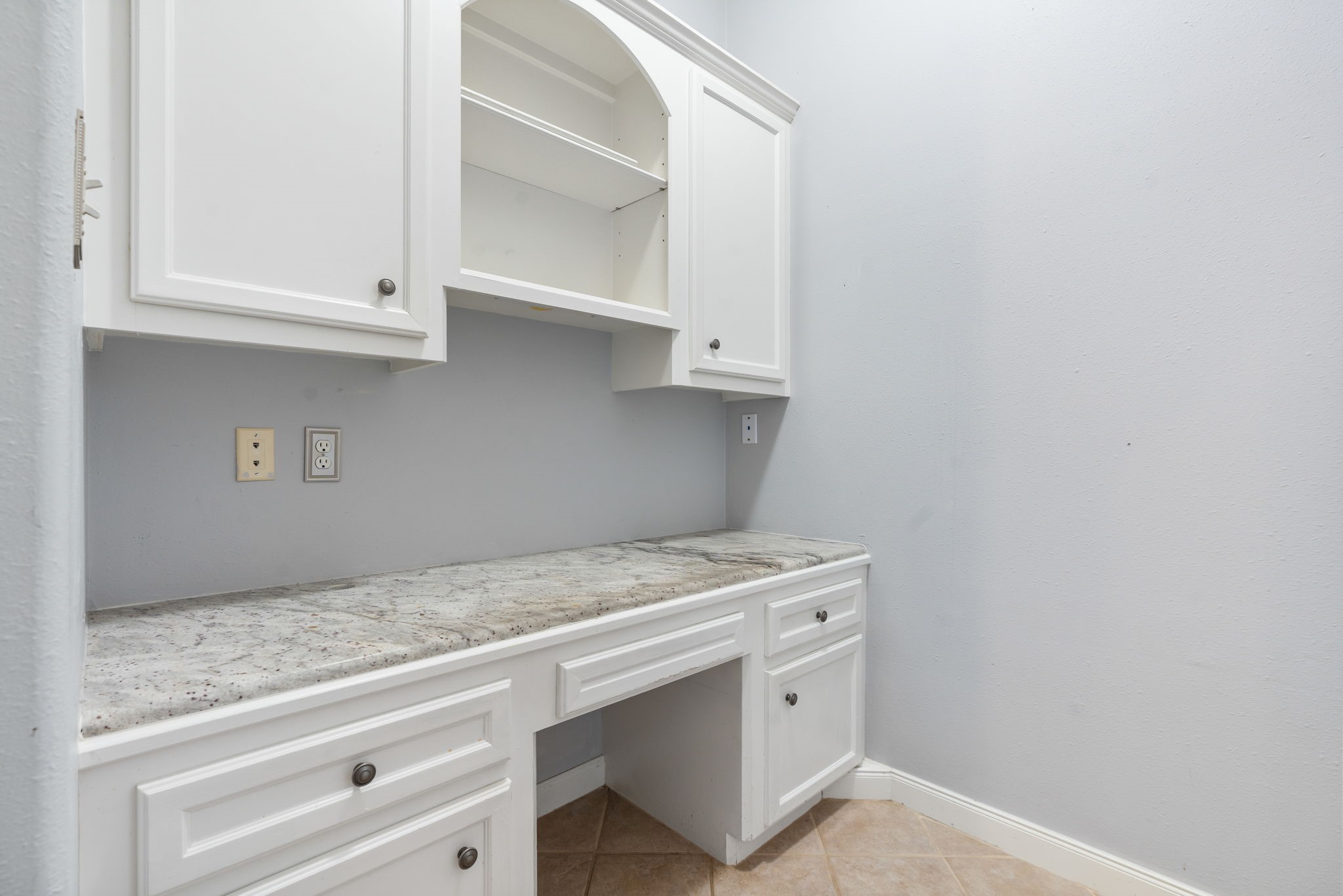 11506 Walden Road Montgomery, TX 77356 - Photo 33 of 50 a utility room with granite countertop cabinets washer and dryer