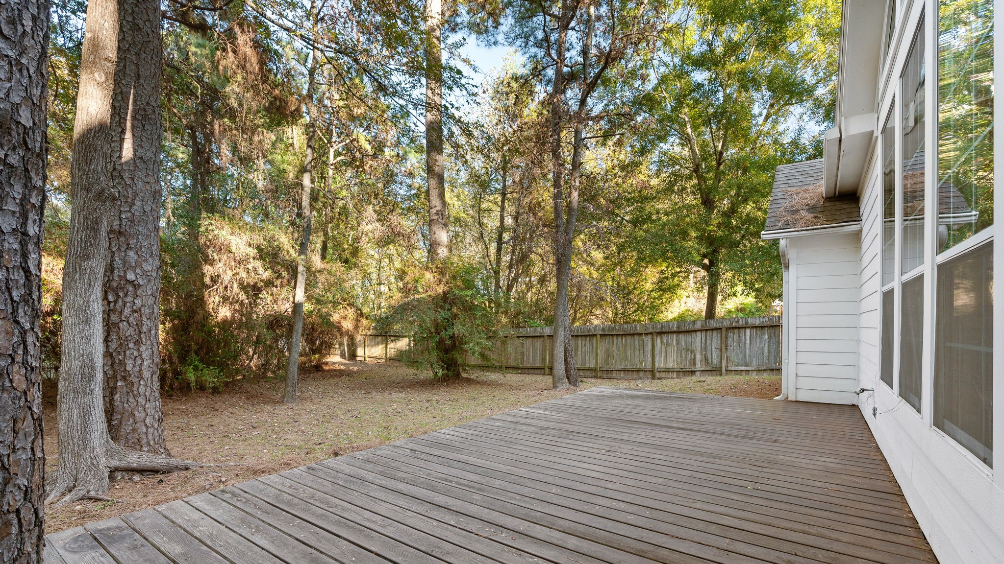 11506 Walden Road Montgomery, TX 77356 - Photo 36 of 50 a view of outdoor space with deck and tree