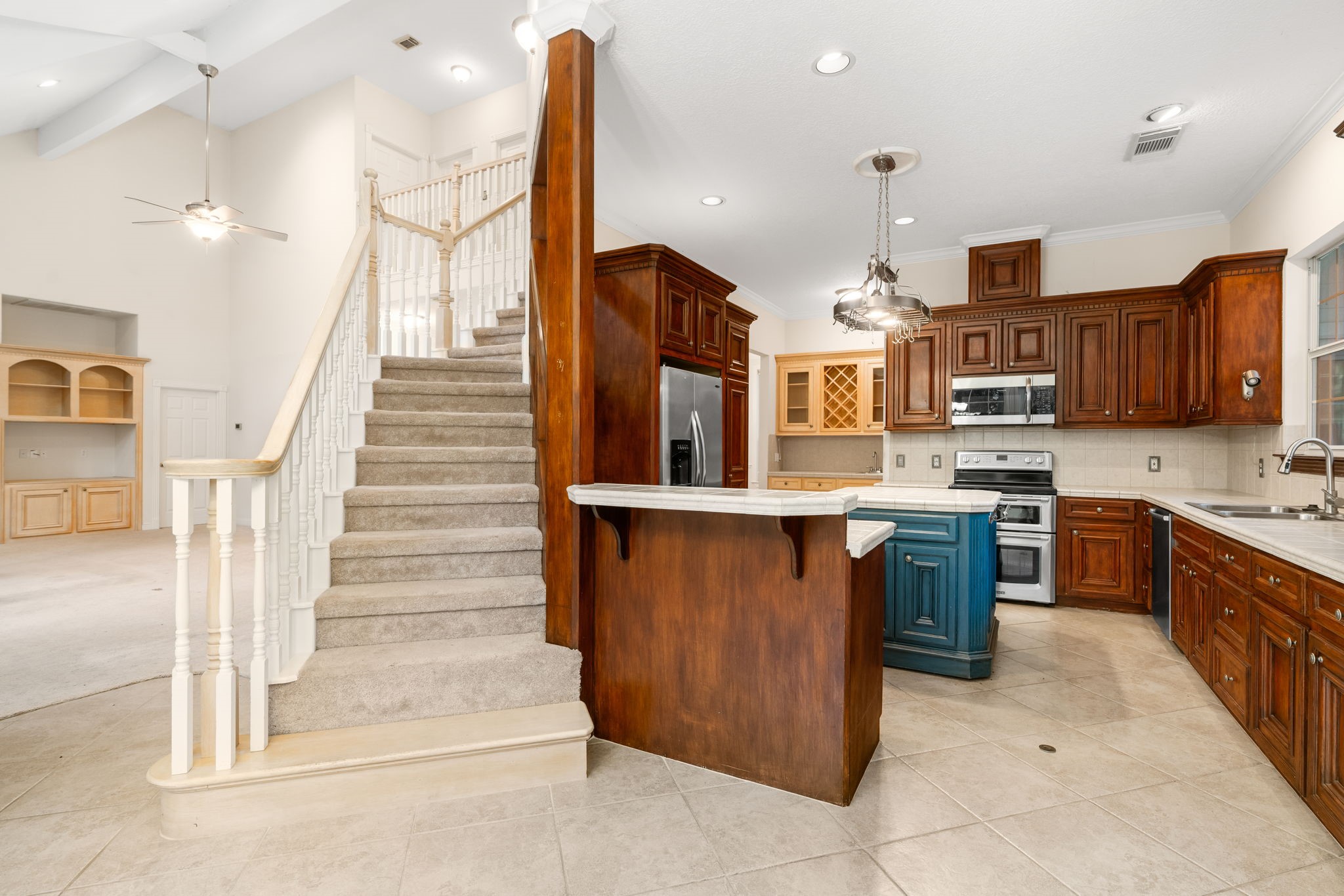 11506 Walden Road Montgomery, TX 77356 - Photo 7 of 50 a kitchen with stainless steel appliances granite countertop a stove a sink and a refrigerator