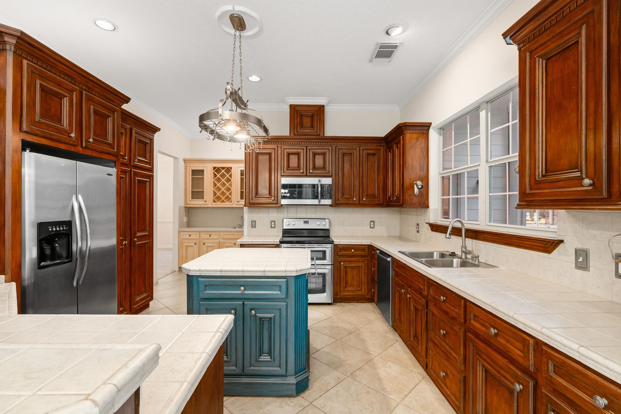 11506 Walden Road Montgomery, TX 77356 - Photo 9 of 50 a kitchen with stainless steel appliances granite countertop a sink stove and refrigerator