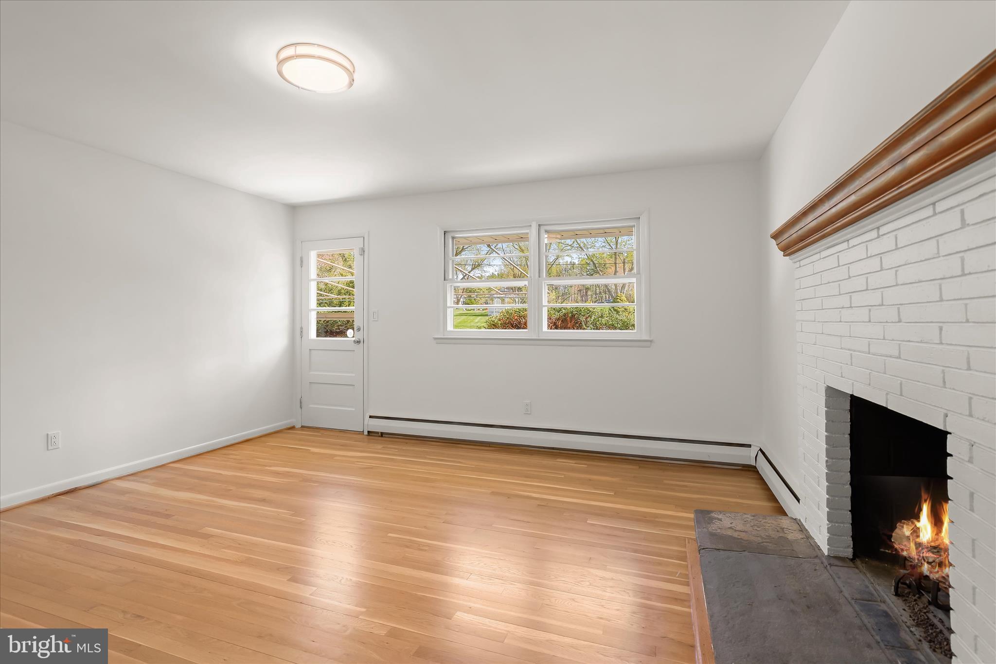 1910 Lyden Road Lutherville-Timonium, MD 21093 - Photo 12 of 51 Gas Fireplace & Access to Patio Door