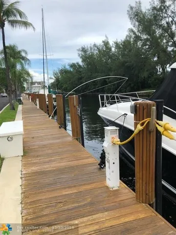 a view of a house with wooden deck