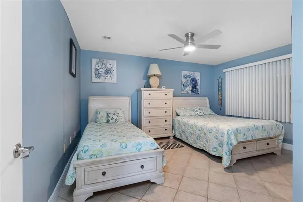 a bedroom with a bed and a view of kitchen
