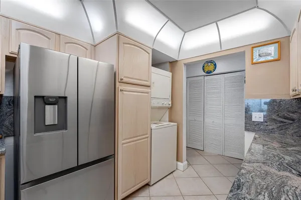 a kitchen with stainless steel appliances granite countertop a sink and cabinets