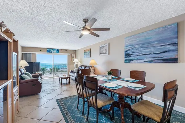 a living room with furniture a window and a table