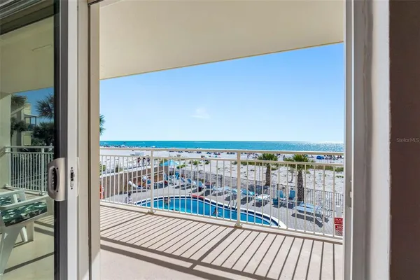 a living room with furniture a rug and a fireplace