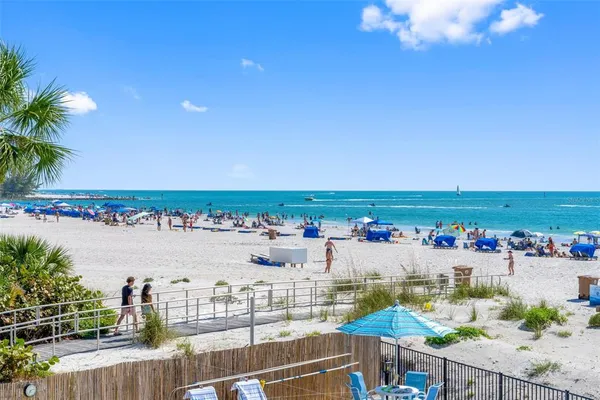 a living room with furniture and a lamp
