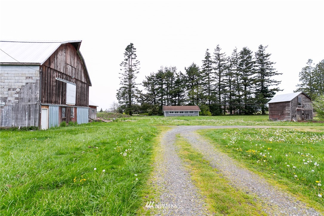776 West Smith Road Bellingham, WA 98226 - Photo 24 of 29 a view of a house with yard and a garden